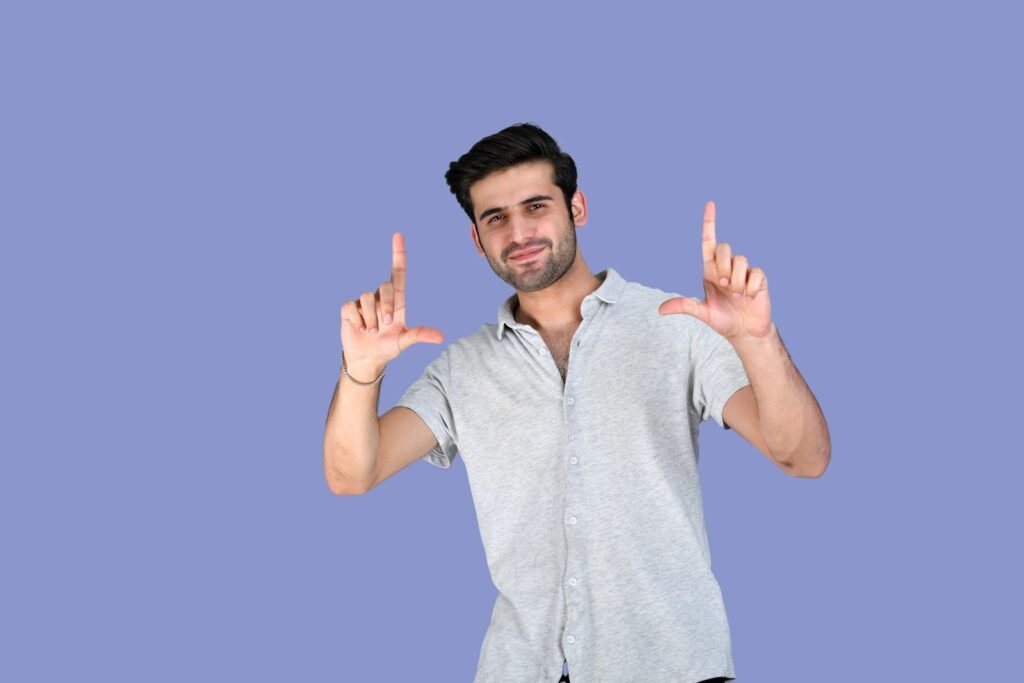 a man holding his hands up